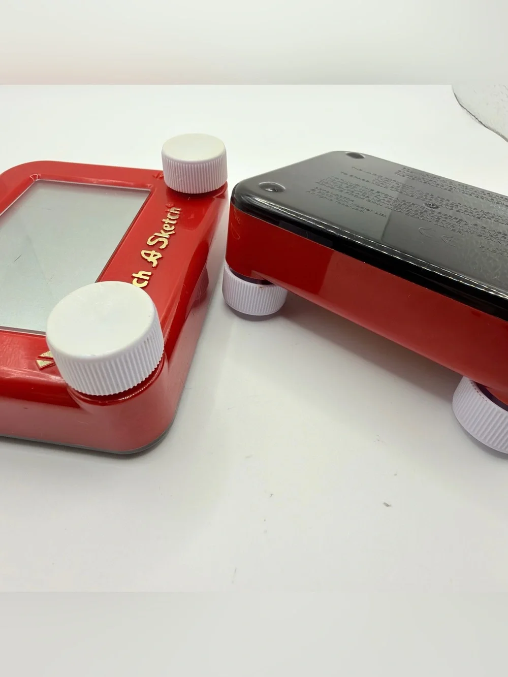 Pair of Mini Classic Red etch a Sketch toys